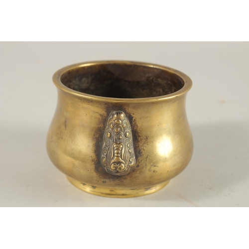 66 - A CHINESE BRONZE OR BRASS TWIN HANDLE CENSER, the base with six-character mark, 7.5cm high.