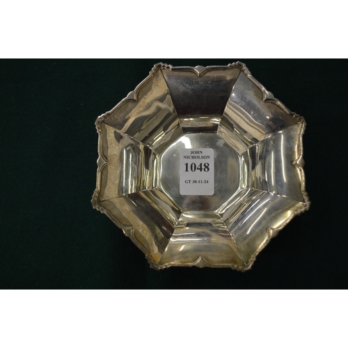 1048 - A small silver octagonal shaped pedestal bowl by the Goldsmith & Silversmiths Company Ltd.