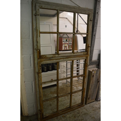 191 - A large unusual distressed painted finish pine mirror 192cm x 102cm.