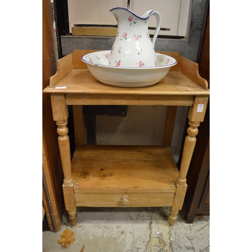 21 - A pine washstand with jug and bowl.