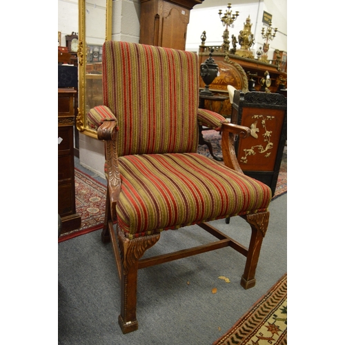 319 - A pair of Georgian style carved mahogany framed open armchairs.