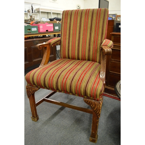 319 - A pair of Georgian style carved mahogany framed open armchairs.