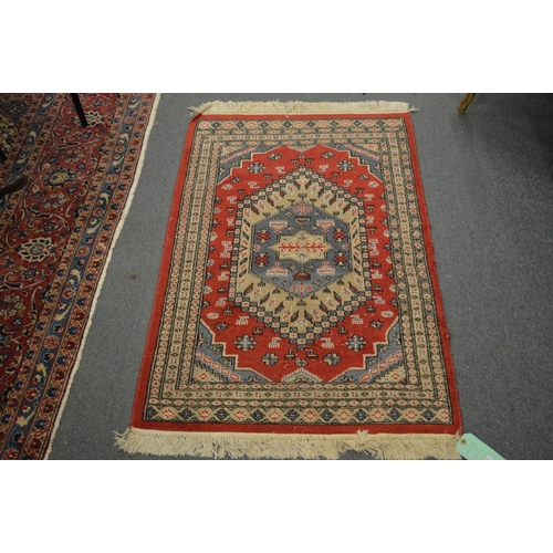 325 - A small Persian style rug.