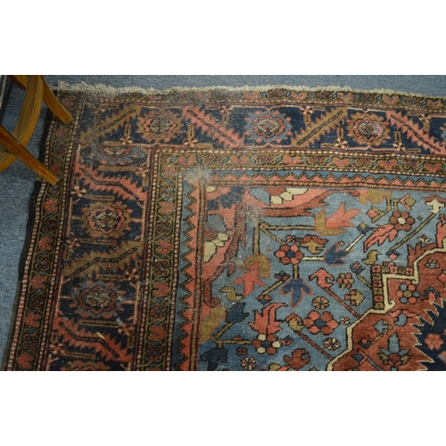 326 - A good Persian carpet, early 20th century, red and blue ground with stylised decoration, 336cm x 253... 