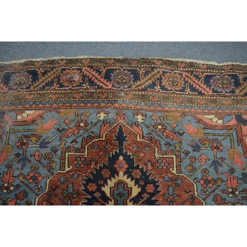 326 - A good Persian carpet, early 20th century, red and blue ground with stylised decoration, 336cm x 253... 