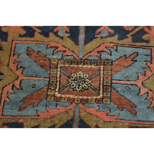 326 - A good Persian carpet, early 20th century, red and blue ground with stylised decoration, 336cm x 253... 