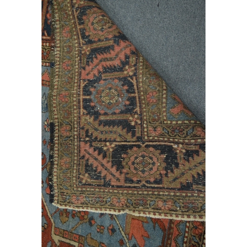 326 - A good Persian carpet, early 20th century, red and blue ground with stylised decoration, 336cm x 253... 