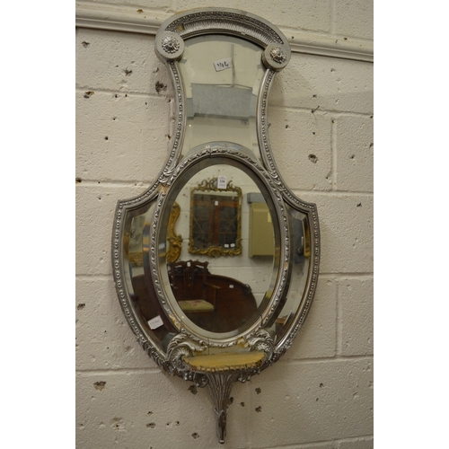 330 - Decorative shaped mirror with silver painted frame.