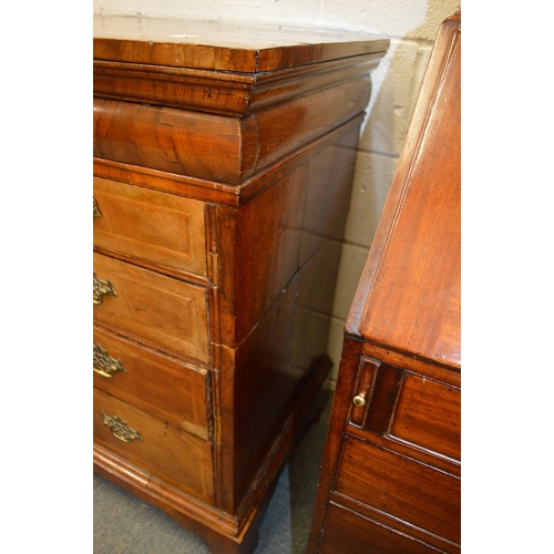 332 - A Georgian walnut and oak straight front chest of drawers, sides cut.