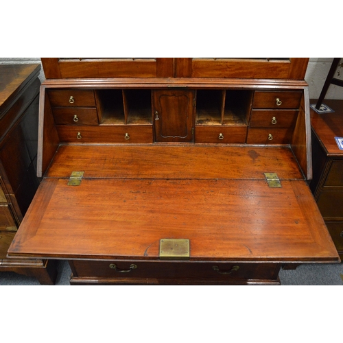 333 - A Georgian mahogany bureau bookcase of typical form.