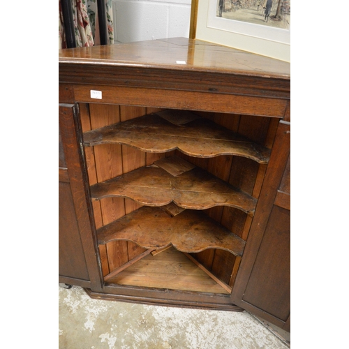 338 - A 19th century oak hanging two door corner cupboard.