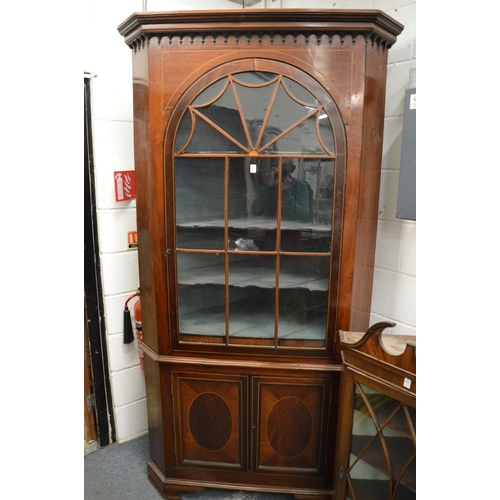 340 - A George III mahogany large standing corner cabinet.