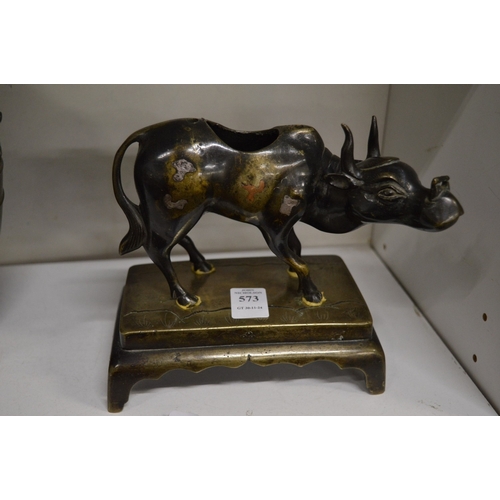 573 - An Indian bronze figure of a bull on a rectangular base.