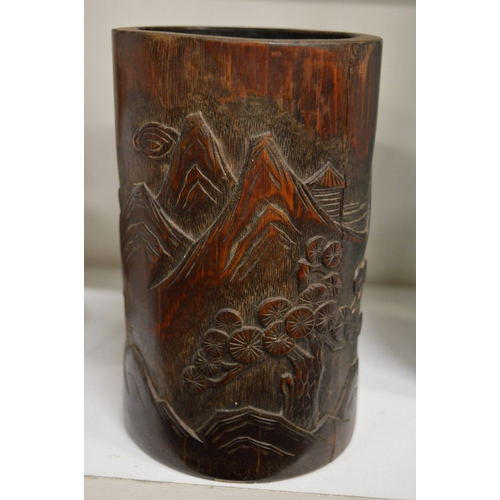 575 - A Chinese carved bamboo brush pot.