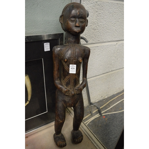 626 - An African carved wood standing female figure.