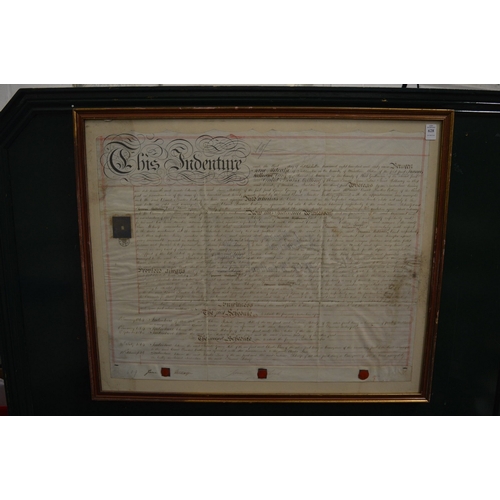 628 - A framed and glazed indenture.