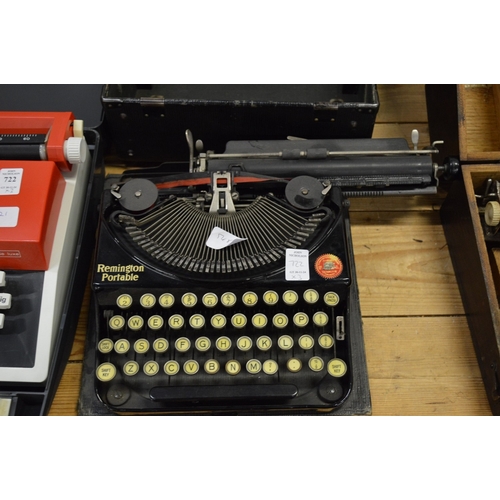 722 - A Blickensderfer Featherweight aluminium typewriter and two other typewriters.