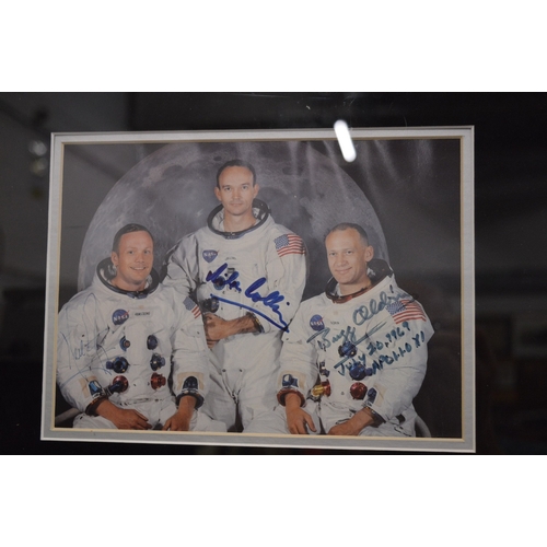 731 - Photographic prints commemorating the Apollo 11 mission, framed as one, one photograph bears signatu... 