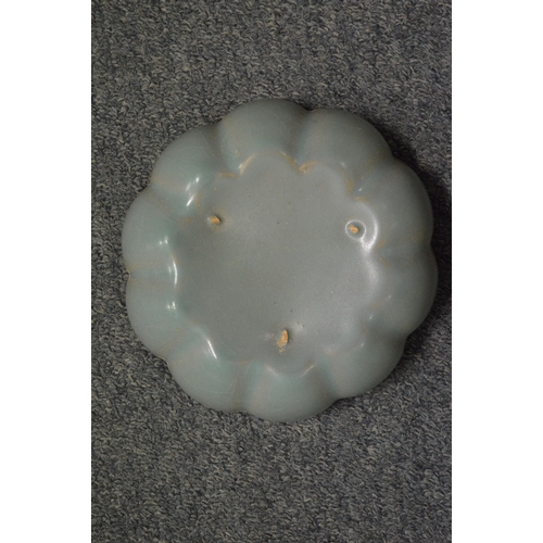 749 - A Chinese celadon glazed petal form bowl.