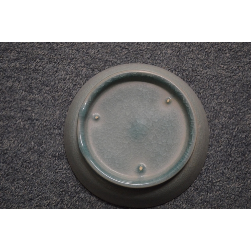 756 - A Chinese celadon circular dish.