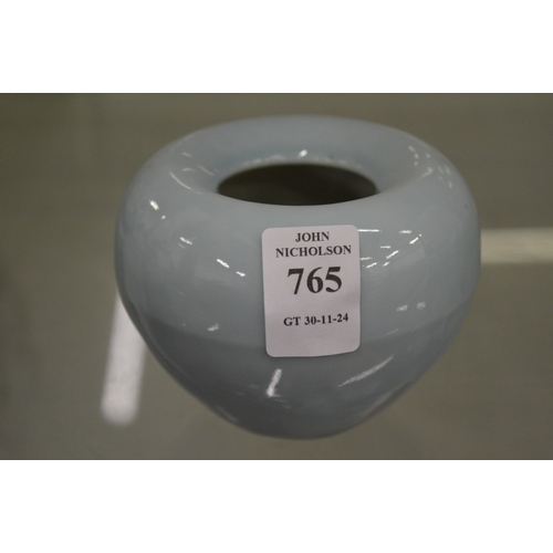 765 - A small pale blue glazed ink pot.