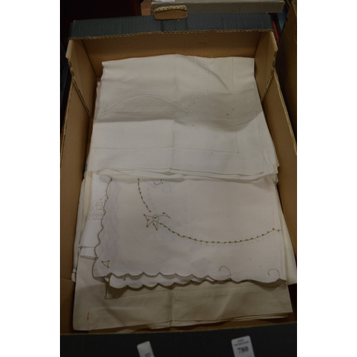 780 - A box of embroidered tablecloths.