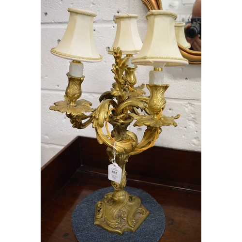 852 - A good pair of Louis XVI style ormolu three branch candelabra.