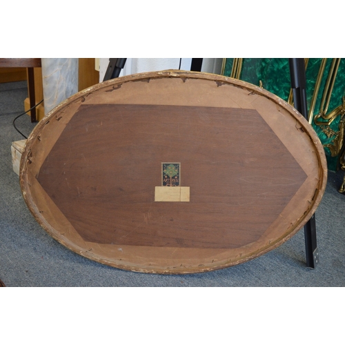 856 - An oval marquetry picture.