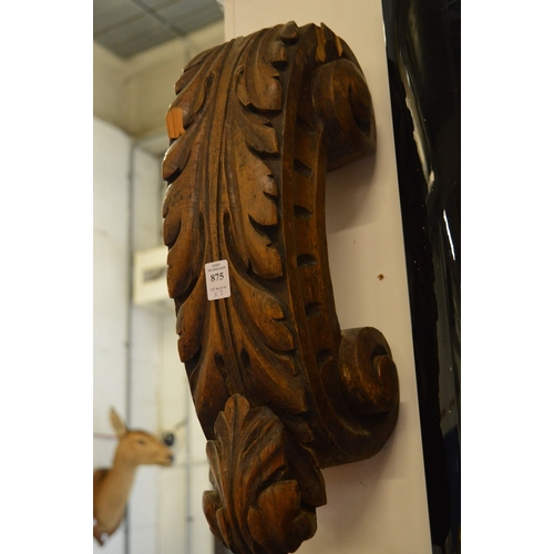 875 - A pair of acanthus carved C scroll brackets and another carved item.