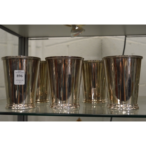 896 - A set of five plated beakers.