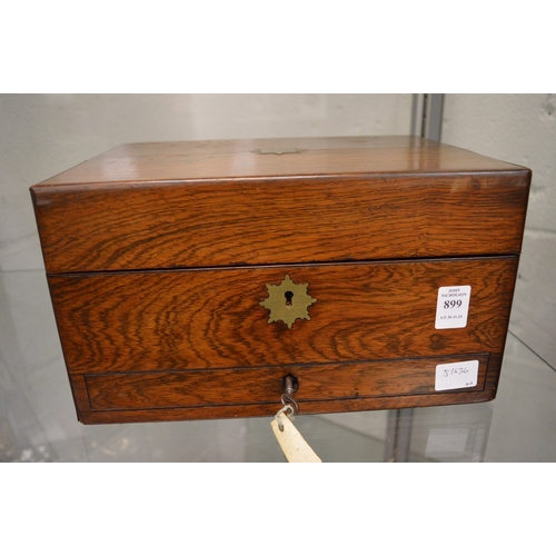 899 - A good Victorian rosewood vanity box containing a fitted interior with cut glass and silver topped j... 