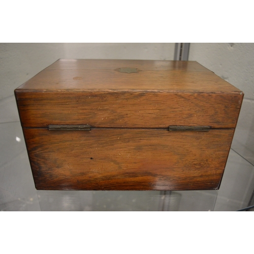 899 - A good Victorian rosewood vanity box containing a fitted interior with cut glass and silver topped j... 