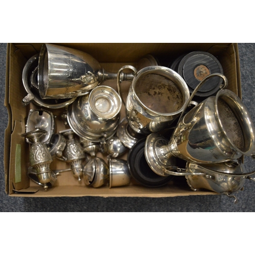 916 - A group of silver trophy cups, various condiments etc.