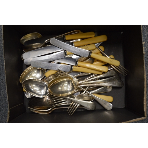 921 - A quantity of plated flatware.