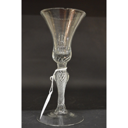 947 - A 19th century Continental wine glass with inverted bell shaped bowl and clear air twist knopped ste... 