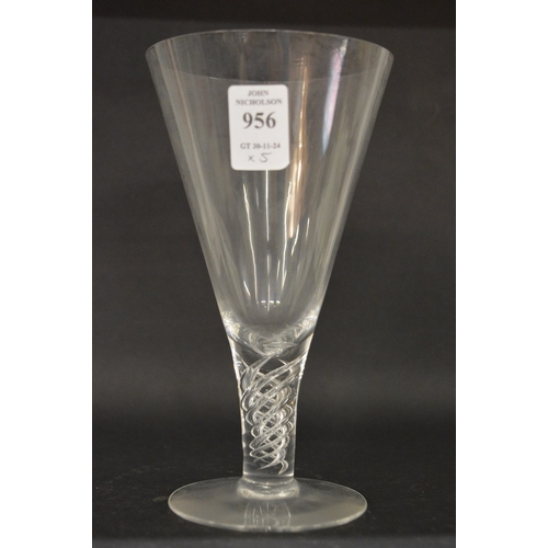 956 - A set of five large conical shaped wine glasses with clear air twist stems.