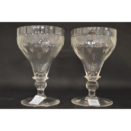 958 - A good pair of large cut glass wine glasses.