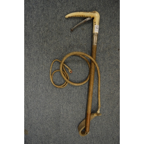 964 - An unusual riding whip by Swaine & Adeney with silver collar, the stag antler handle incorporating a... 