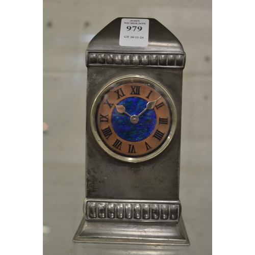 979 - Liberty & Co, a Tudric mantel clock, no. 01034 with copper chapter ring, enamel decoration to the ce... 