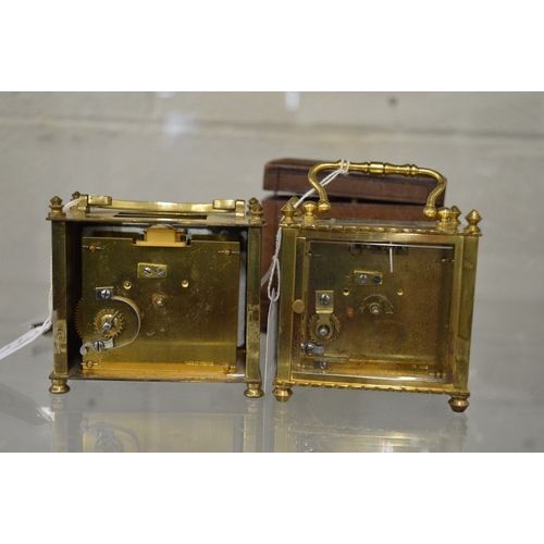 980 - Two brass carriage clocks, both with faults together with a leather travelling case.