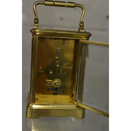 981 - Large brass carriage clock with leather travelling case and key.