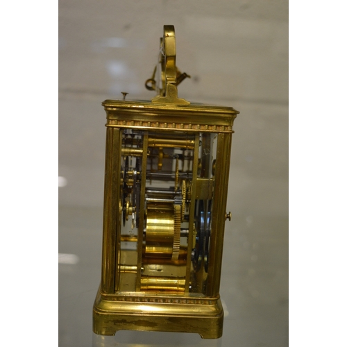 982 - A brass striking carriage clock.