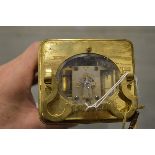 982 - A brass striking carriage clock.