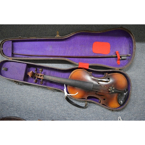 655 - A cased violin.