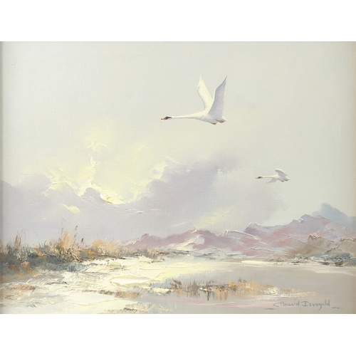 207 - C. HOWARD DEVONALD (b. 1944). Swans flying over water with hills beyond, oil on canvas. Signed, 14