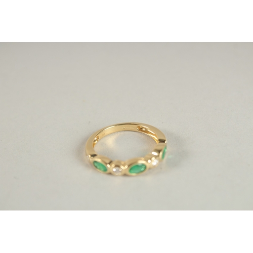 1000 - AN 18CT YELLOW GOLD, EMERALD AND DIAMOND HALF HOOP ETERNITY RING.