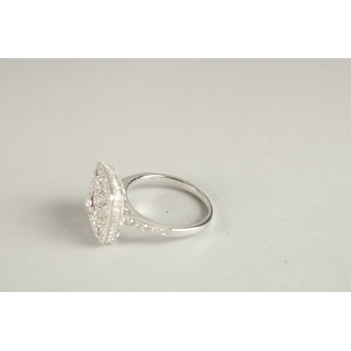 1001 - AM 18CT WHITE GOLD AND DIAMOND ART DECO DESIGN RING, with diamond set bezels and shoulders.