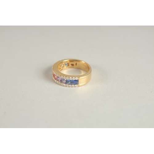 1002 - AN 18CT YELLOW GOLD AND MULTI-COLOURED SAPPHIRE AND DIAMOND HALF HOOP RING.