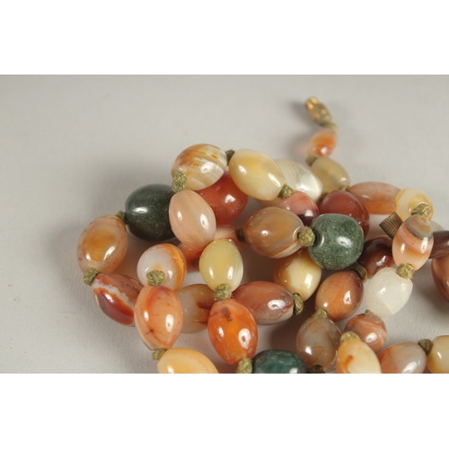 1004 - A SCOTTISH AGATE BEAD NECKLACE. 72cms long.