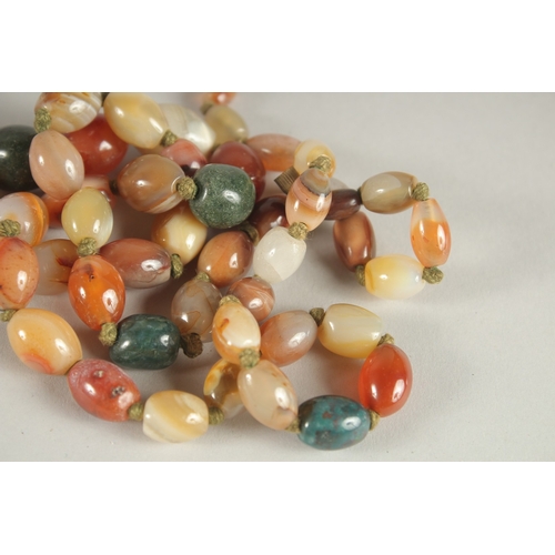 1004 - A SCOTTISH AGATE BEAD NECKLACE. 72cms long.